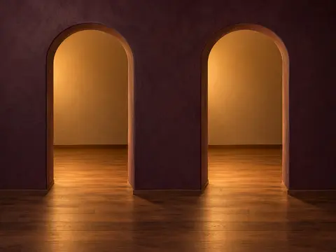 Two identical arched doorways, both lit warmly from within; nothing tells them apart.